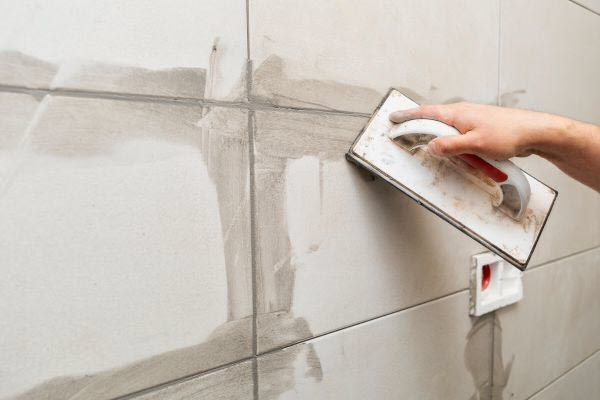 Tiler Regrouting Wall Tiles